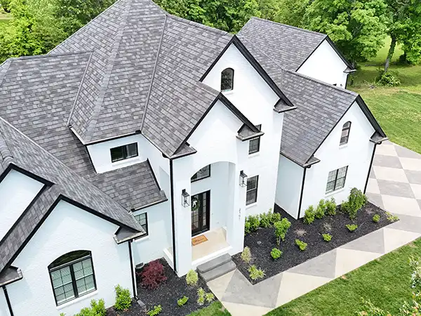 High-end home with a gray shingle roof